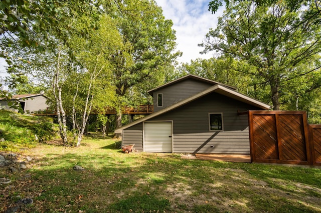 view of outbuilding with a yard