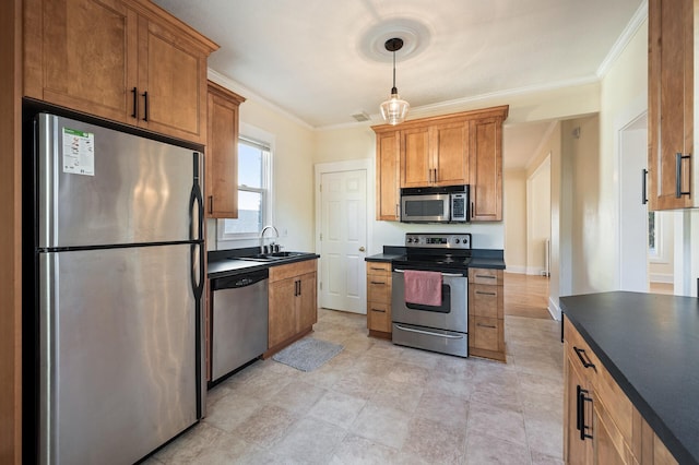 kitchen featuring sink, crown molding, appliances with stainless steel finishes, and decorative light fixtures