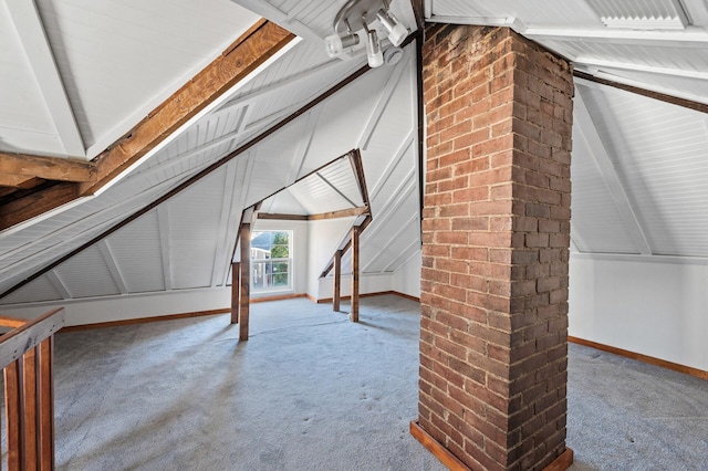 bonus room featuring carpet and lofted ceiling with beams