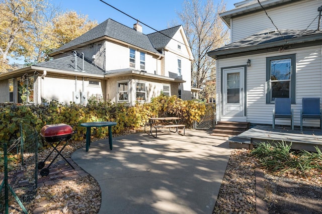 back of property with a patio area