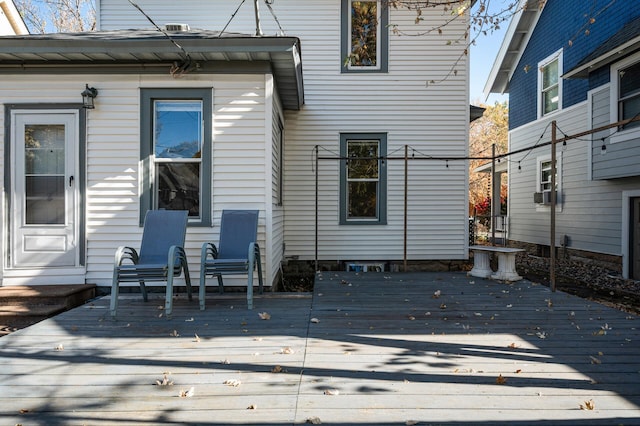 wooden terrace featuring cooling unit