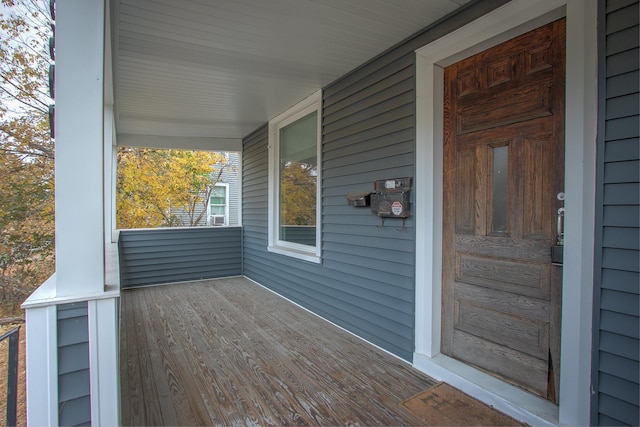 wooden terrace featuring covered porch