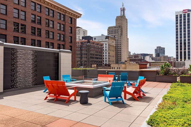 view of patio with an outdoor fire pit