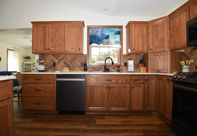 kitchen featuring decorative backsplash, sink, stainless steel appliances, and dark hardwood / wood-style flooring