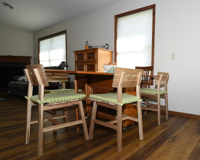 dining area featuring dark hardwood / wood-style flooring