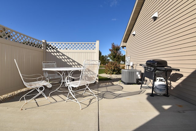 view of patio / terrace featuring a grill and central air condition unit