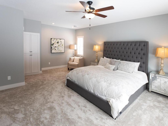 carpeted bedroom with ceiling fan