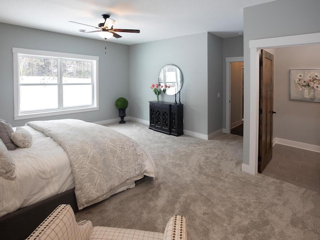 carpeted bedroom featuring ceiling fan