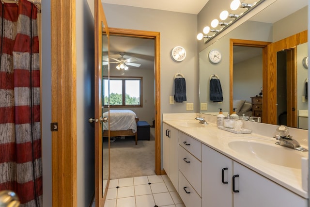 bathroom with tile patterned floors, ceiling fan, and vanity