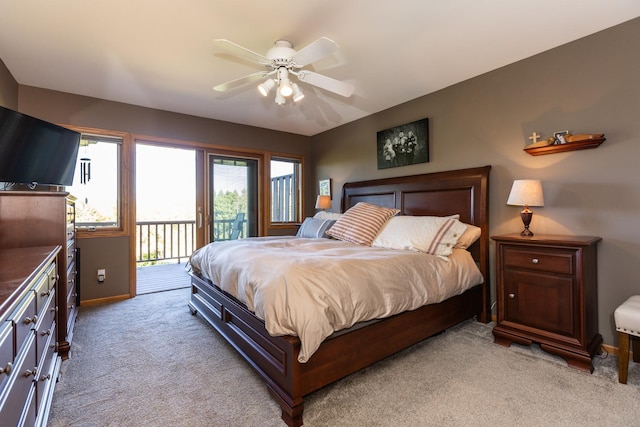 bedroom featuring access to outside, ceiling fan, and light colored carpet