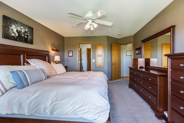 bedroom featuring ceiling fan and light colored carpet