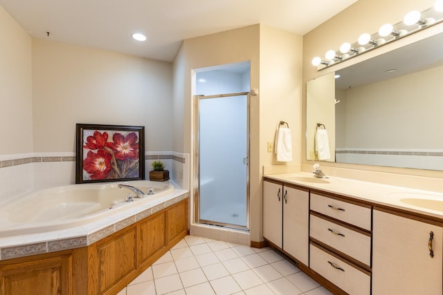 bathroom with tile patterned flooring, vanity, and separate shower and tub