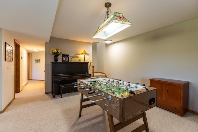 recreation room featuring light carpet