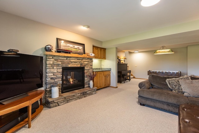 living room featuring a stone fireplace and light carpet