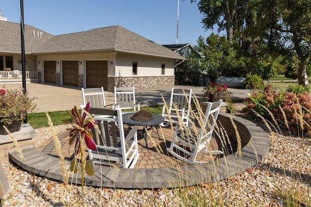 view of patio featuring a garage