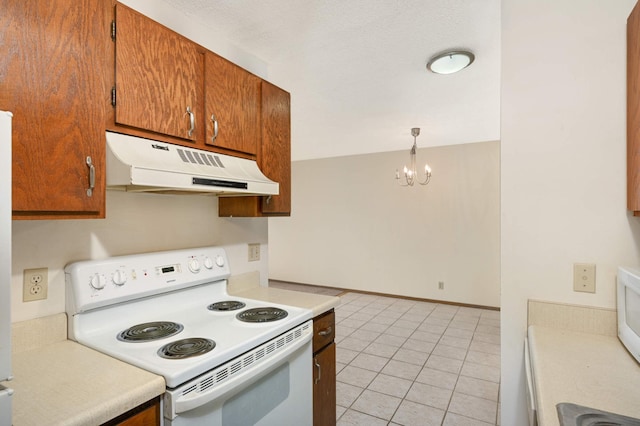 kitchen featuring white range with electric cooktop, light tile patterned flooring, hanging light fixtures, and a chandelier