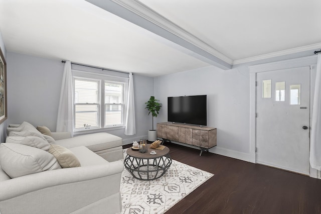 living room featuring dark hardwood / wood-style floors, beam ceiling, and ornamental molding