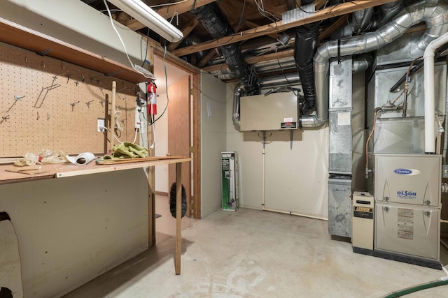 basement featuring a workshop area and heating unit