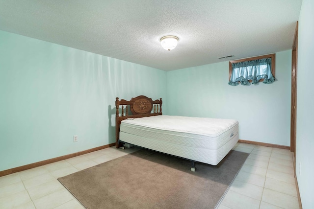 bedroom featuring a textured ceiling