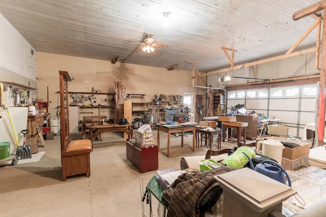 garage featuring ceiling fan and a workshop area