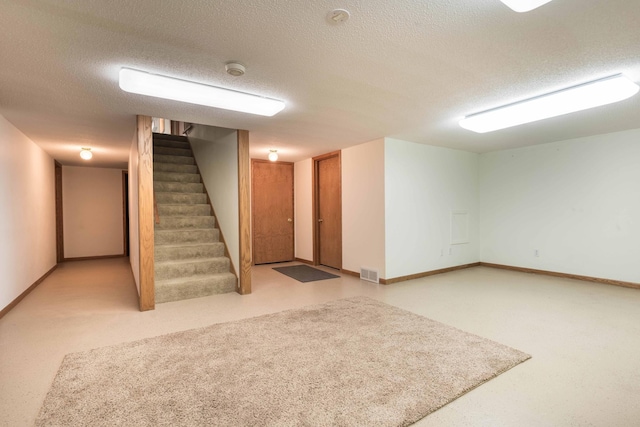 basement with a textured ceiling