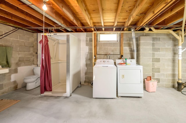 basement featuring washing machine and dryer