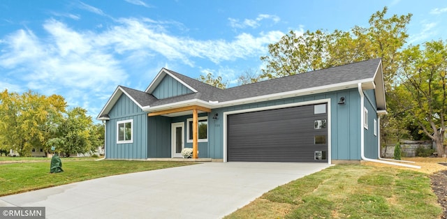 view of front of property featuring a garage and a front lawn