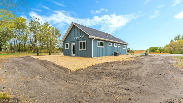 view of property exterior with central AC unit