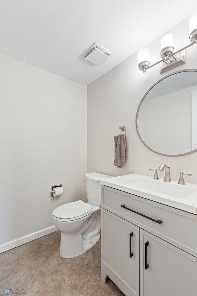 1110 3rd Ave N Unit 801W, Fargo, ND 58102 - half bath with baseboards, visible vents, toilet, and vanity