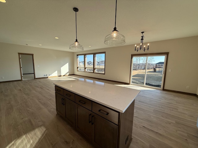 13077 Opal St NE, Blaine, MN 55449 - kitchen featuring wood finished floors, plenty of natural light, and open floor plan