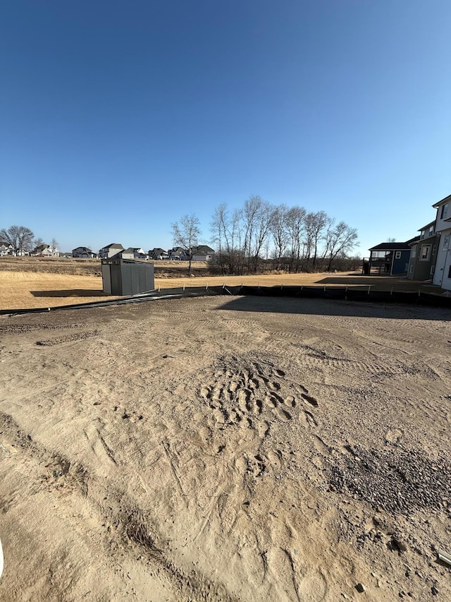 13077 Opal St NE, Blaine, MN 55449 - view of yard featuring an outdoor structure and a shed