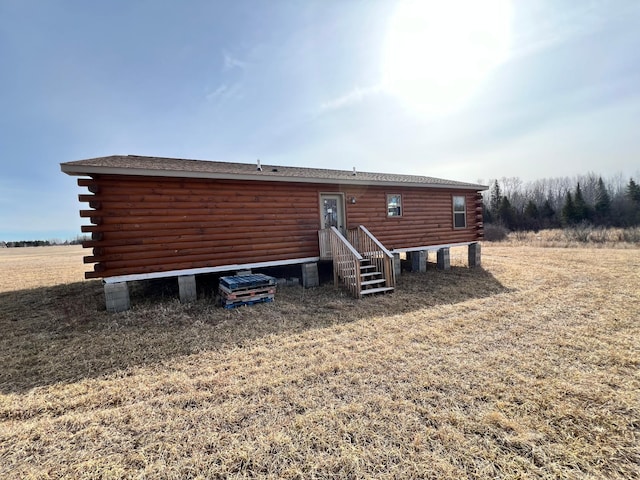rear view of property featuring log exterior
