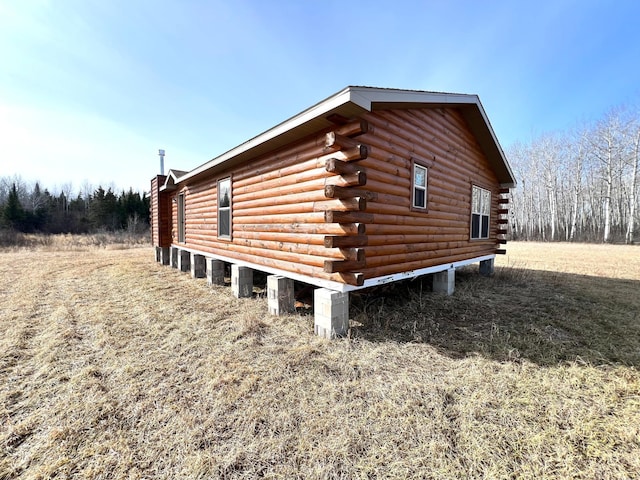 view of side of property with log exterior