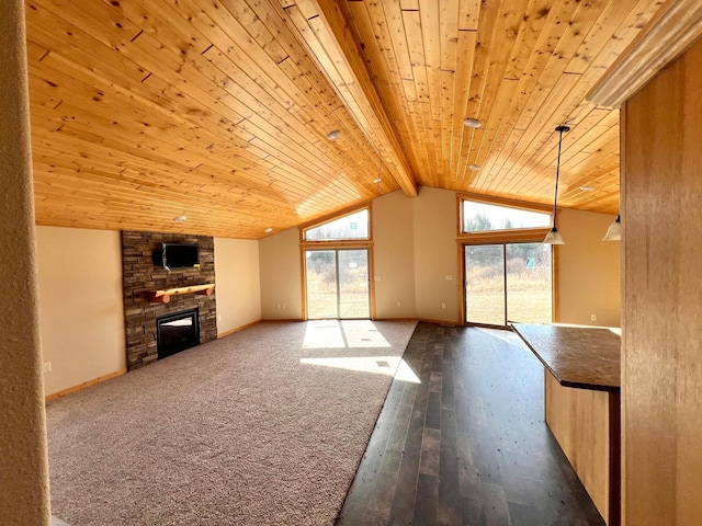 unfurnished living room featuring lofted ceiling with beams, dark wood finished floors, wood ceiling, baseboards, and a stone fireplace