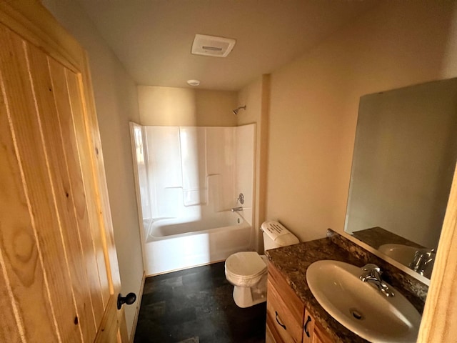bathroom with toilet, vanity, and bathtub / shower combination