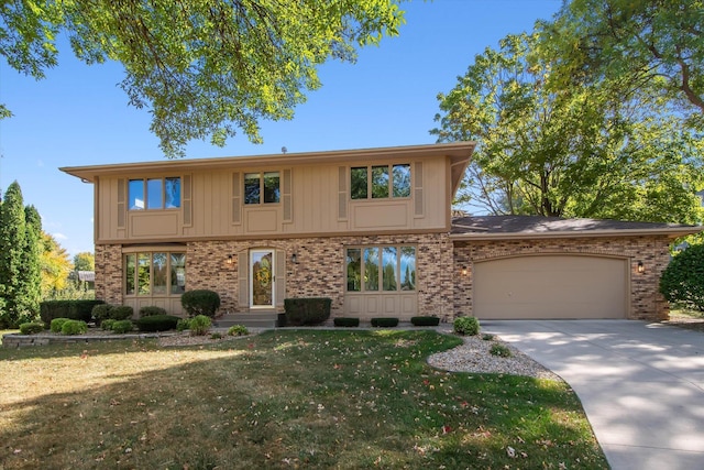 view of front of home featuring a front lawn and a garage