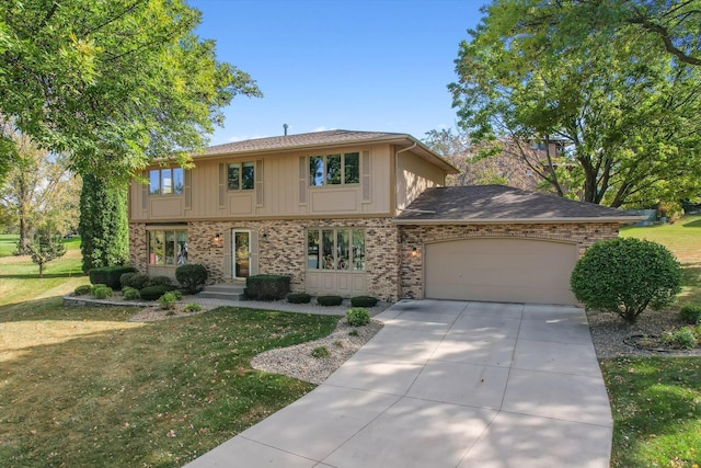 view of front of house with a garage and a front lawn