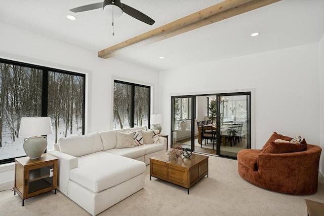 living area with recessed lighting, beam ceiling, light carpet, and a ceiling fan