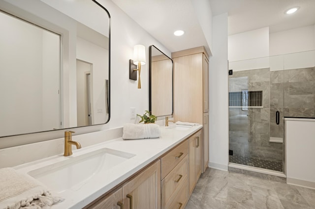 bathroom with double vanity, recessed lighting, a shower stall, and a sink