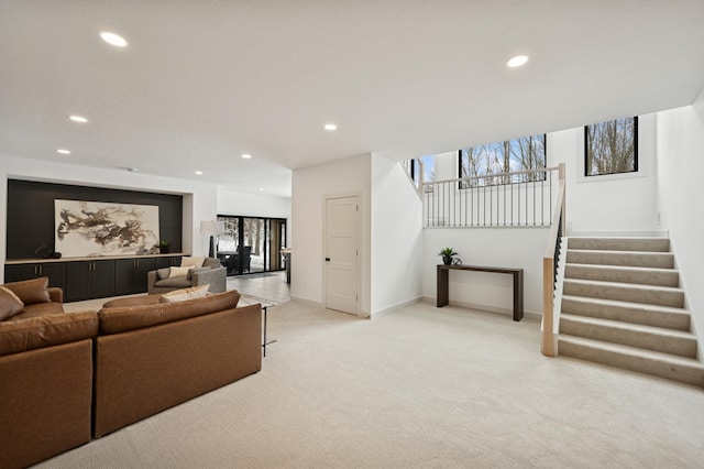 living room featuring light carpet, stairway, recessed lighting, and baseboards