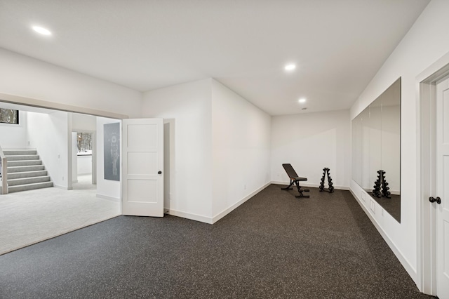 workout room featuring recessed lighting and baseboards