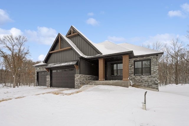 view of front of home featuring board and batten siding, a porch, and stone siding