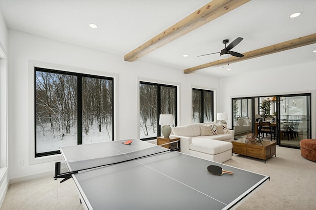 rec room featuring a ceiling fan, beam ceiling, recessed lighting, and light carpet