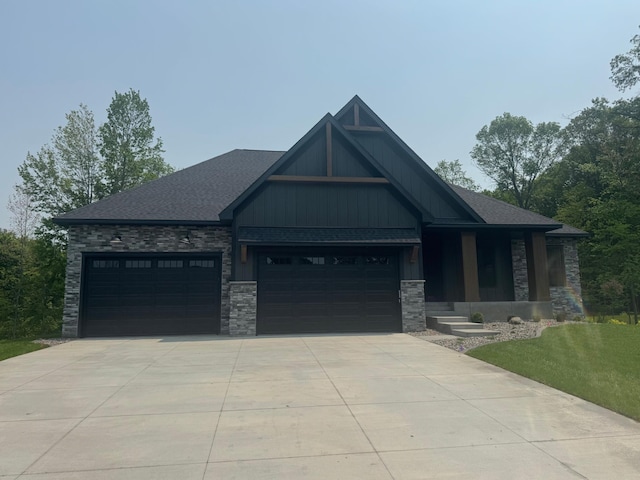 14805 Stutz St NE, Ham Lake, MN 55304 - craftsman inspired home featuring stone siding, concrete driveway, an attached garage, roof with shingles, and a front lawn