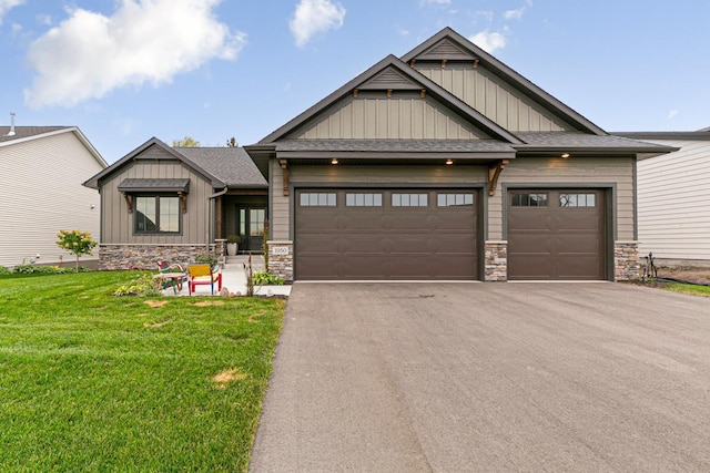 craftsman-style house with a garage and a front lawn