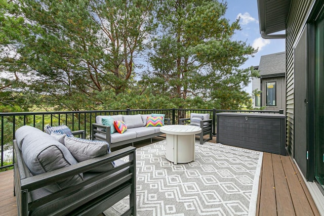 wooden terrace with outdoor lounge area