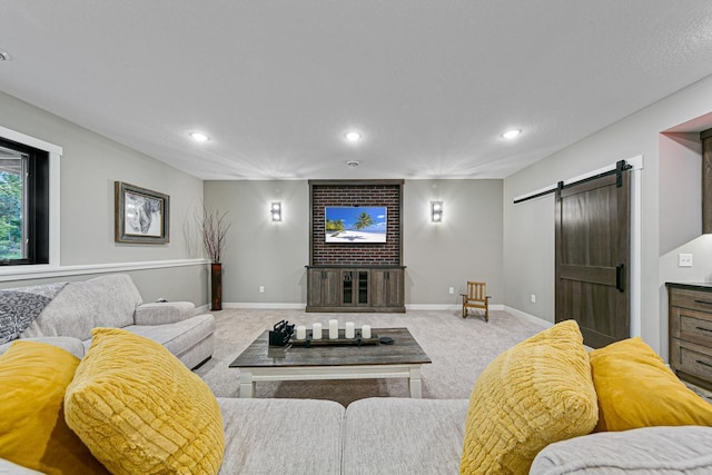 living room with a barn door and light carpet