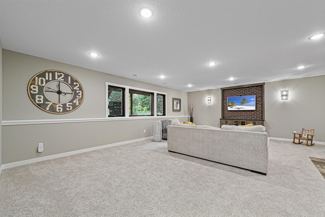 carpeted living room featuring a textured ceiling