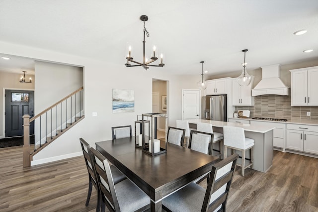 dining room featuring baseboards, stairway, dark wood-style flooring, an inviting chandelier, and recessed lighting