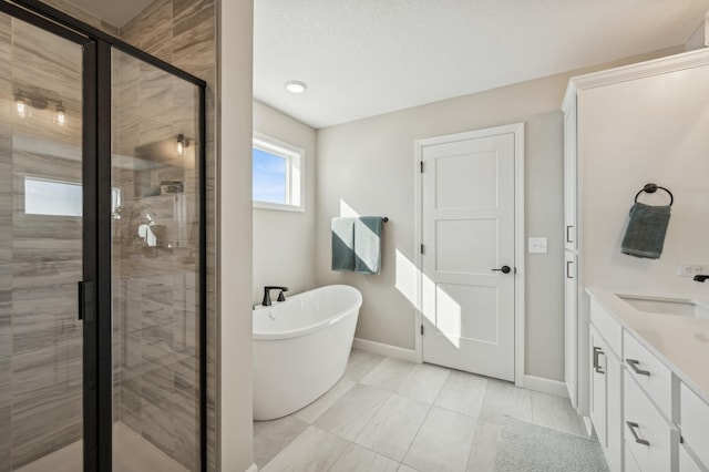 full bath featuring a stall shower, baseboards, a freestanding bath, and vanity